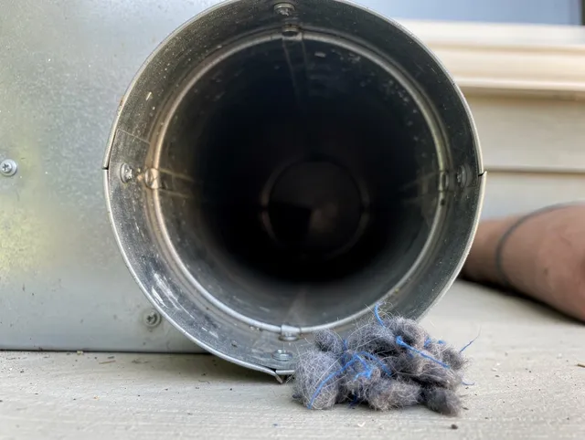 Palos Verdes Estates Dryer Vent Cleaning technician using specialized equipment to clear severe dryer vent blockage in Palos Verdes Estates